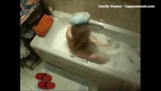 My mom in bath tube using jet water to cum. Hidden cam
